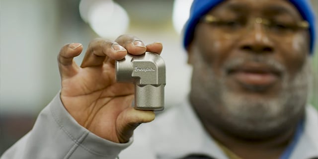 Swagelok associate holding a tube fitting