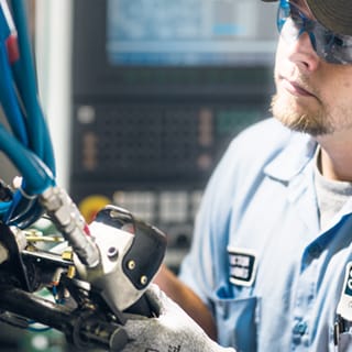 oil-rig-worker-inspecting-equipment