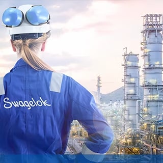 Swagelok field engineer overlooking an oil & gas refinery