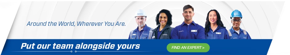 A professional Swagelok team member working alongside a client, collaborating on a fluid system solution with expert consultation and customized support.