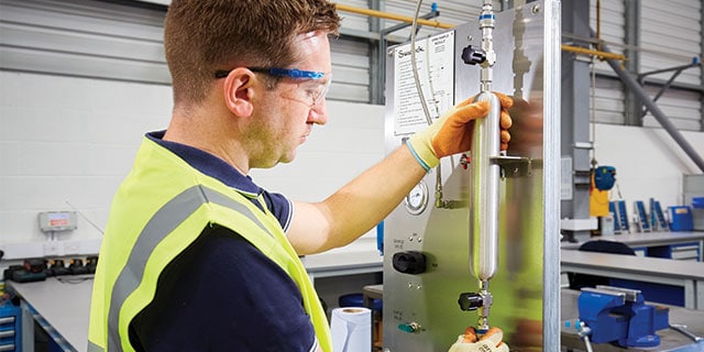 image of a swagelok technician assembling a grab sample station