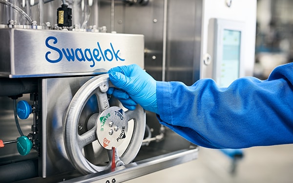 ammonia grab sampler, person with gloved hand is grabbing the knob to modify settings. 