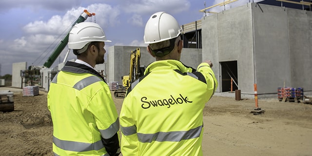 Engineers surveying construction site