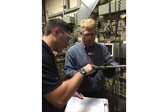 Mike Gagel and Gary Osman Inspect a Hose