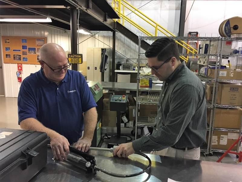 Mike Koster and Gary Osman in the Fabrication Center.