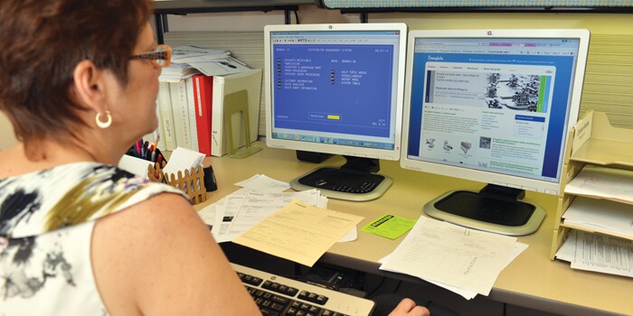 Charlene Konzier working at desk.