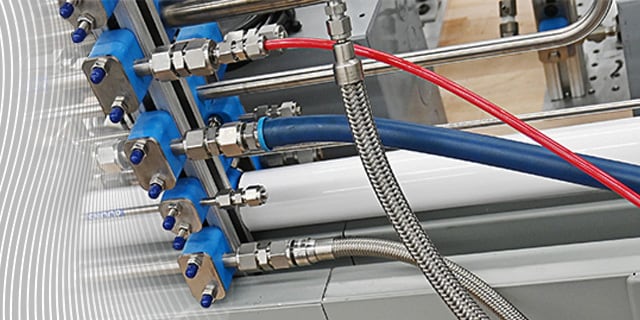 Several Swagelok hoses in different material hooked up to a fluid system