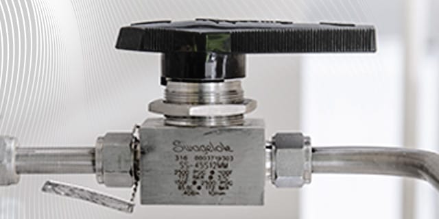 Stainless steel valve installed in an instrumentation tubing line.