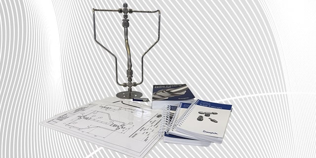 A tube bending structure along with multitude of Swagelok training material next to it