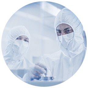 Scientists working with chemistry set in research lab