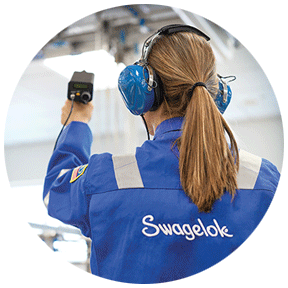 Swagelok field engineer using an ultrasonic leak detector