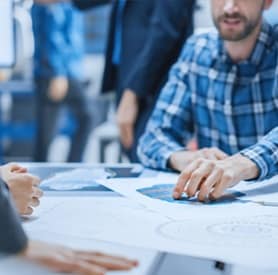 Engineer reviewing front‑end engineering design documentation