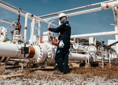 Engineer inspecting an oil and gas pipeline