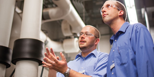 Field engineers having a discussion onsite